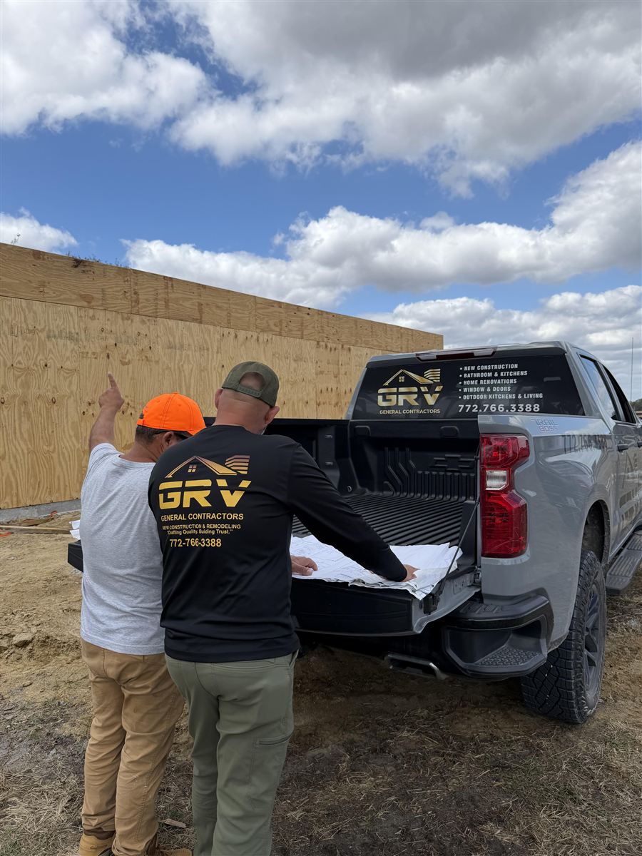 GRV crew reviewing plans on a new construction site